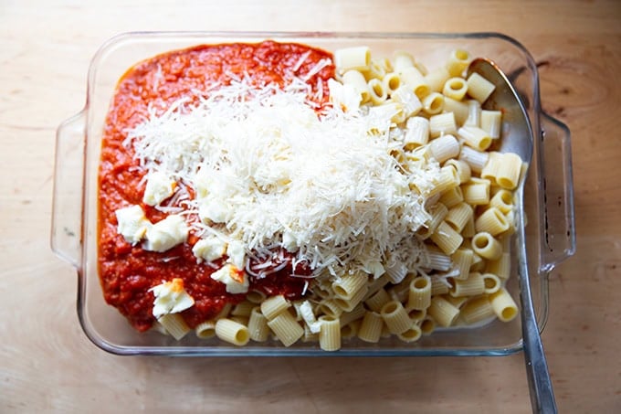 A 9x13-inch pan filled with all of the ingredients to make baked pasta.