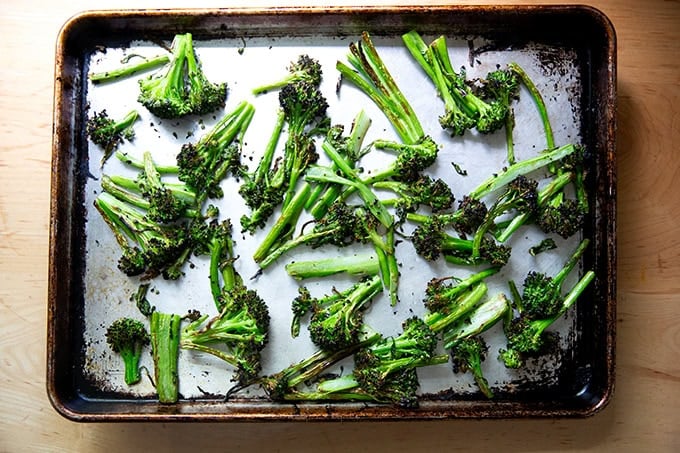 Roasted broccolini on a sheet pan.
