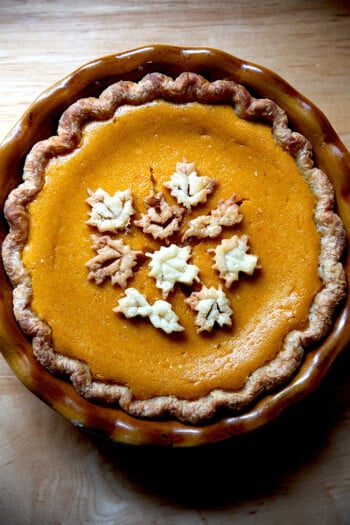 A butternut squash pie decorated with pie dough cookies.