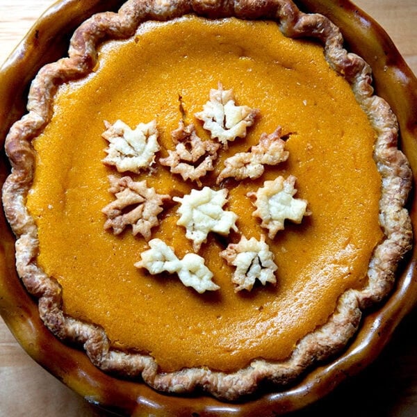 A butternut squash pie decorated with pie dough cookies.