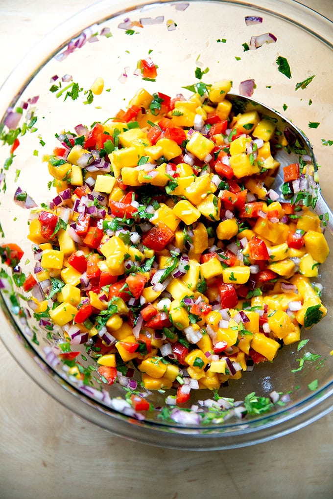 A large bowl of mango salsa.