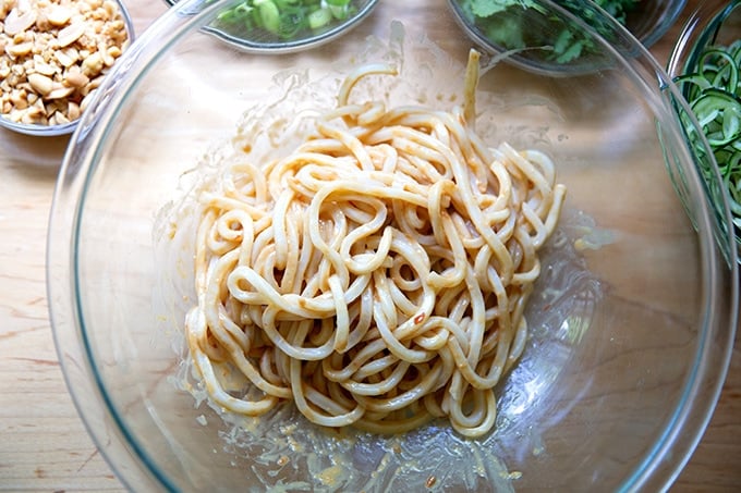 Udon noodles dressed in peanut sauce.