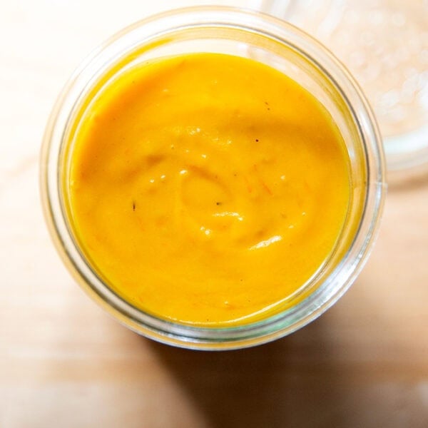 A jar of roasted yellow tomato sauce.