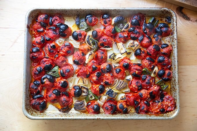 A small sheet pan with just-broiled tomatoes, onions, garlic, and jalapeños.