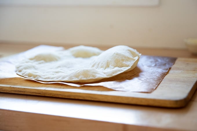 Side view of a parbaked gluten-free pizza crust.