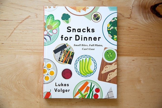 Snacks for Dinner cookbook on the countertop.