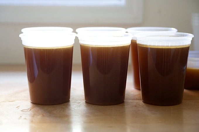 Six quarts of turkey stock on a countertop.