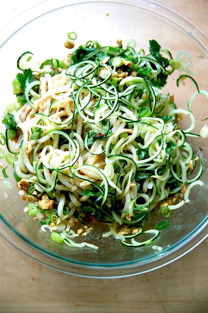 A peanut noodle salad in a large bowl, just tossed.