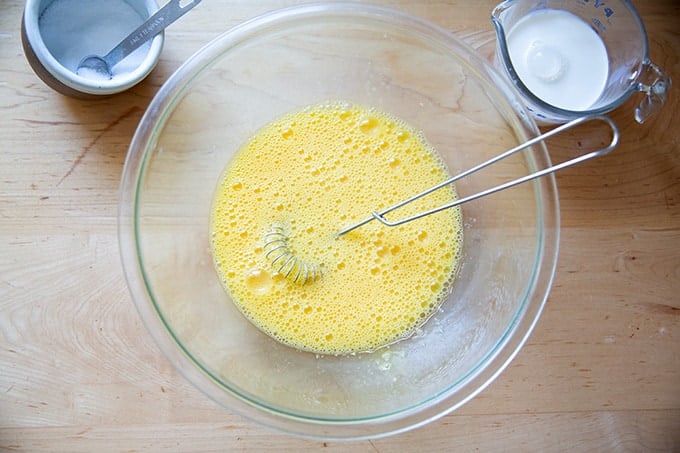 A bowl of beaten eggs.