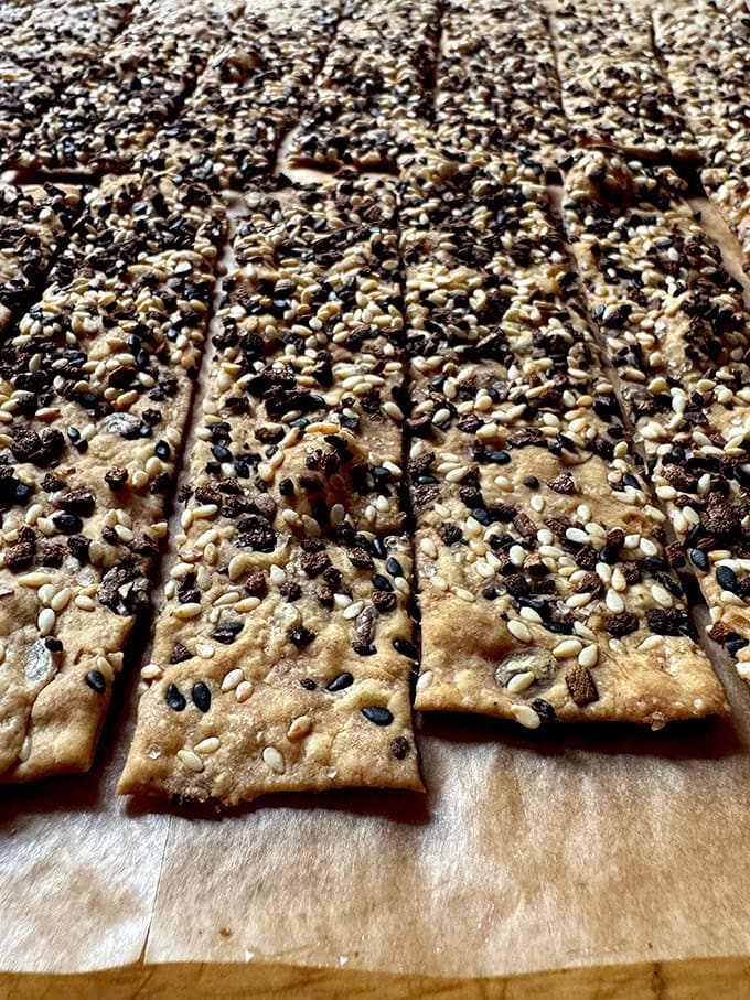 An up-close shot of the edge of just-baked sourdough discard crackers. 