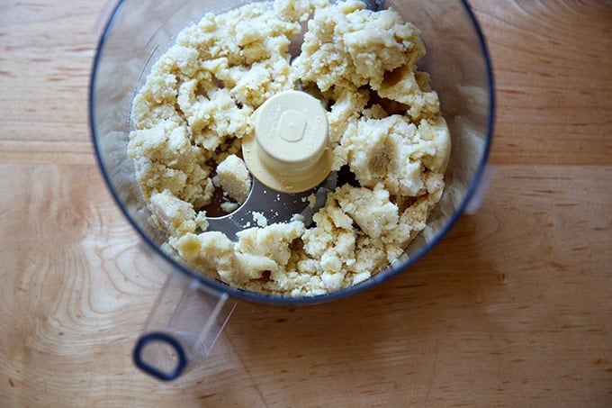 A food processor filled with the crisp topping for strawberry-rhubarb crisp.