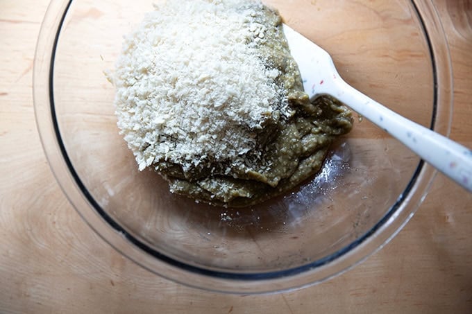Adding the bread crumbs to the eggplant purée.