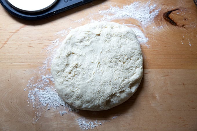 Brioche dough turned out onto a lightly floured work surface.