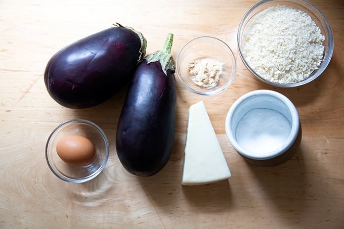 The ingredients to make eggplant meatballs on a countertop.