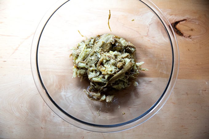 Roasted eggplant flesh in a large bowl.