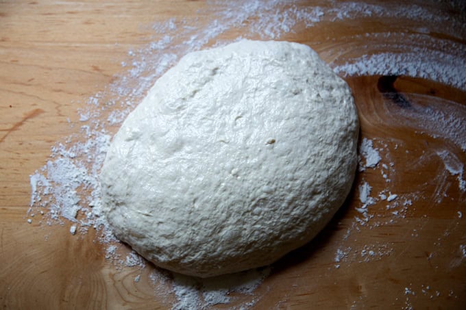 Grandma-style pizza dough turned out onto a floured work surface.