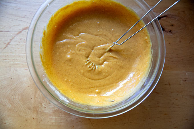 Pumpkin muffin batter whisked together.