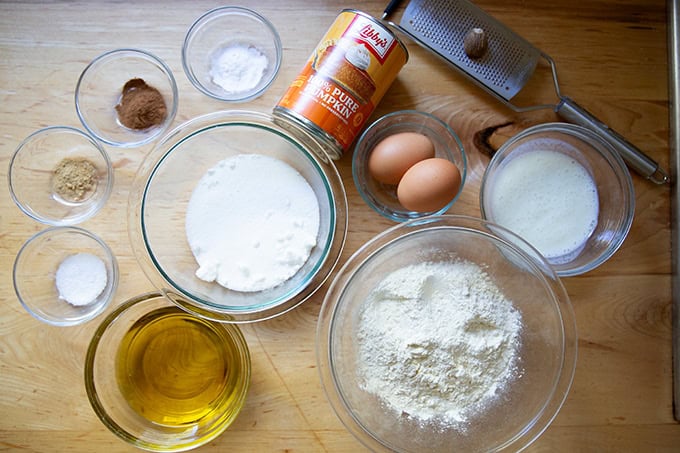 The ingredients to make pumpkin muffins on a countertop.