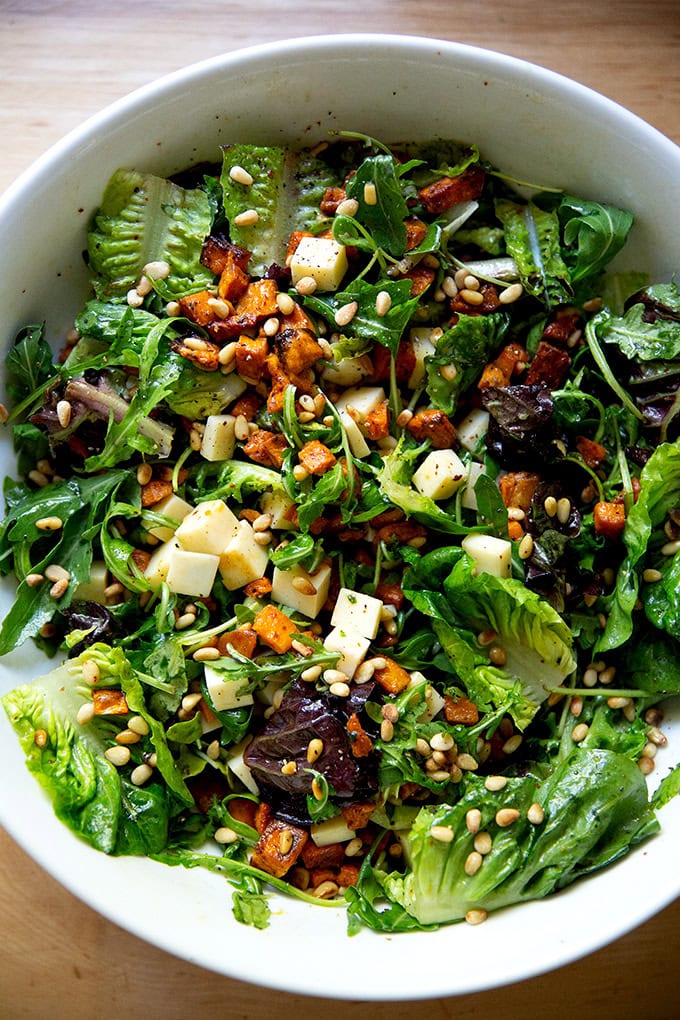 A tossed roasted sweet potato salad with greens, gruyere, toasted pine nuts and apple cider vinaigrette.