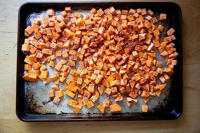 Cubed sweet potatoes tossed with melted coconut oil, salt, and Aleppo pepper.