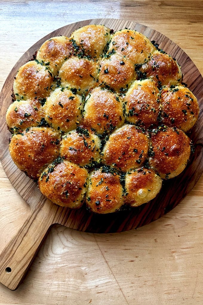 Just baked garlic-herb monkey bread on a cutting board.